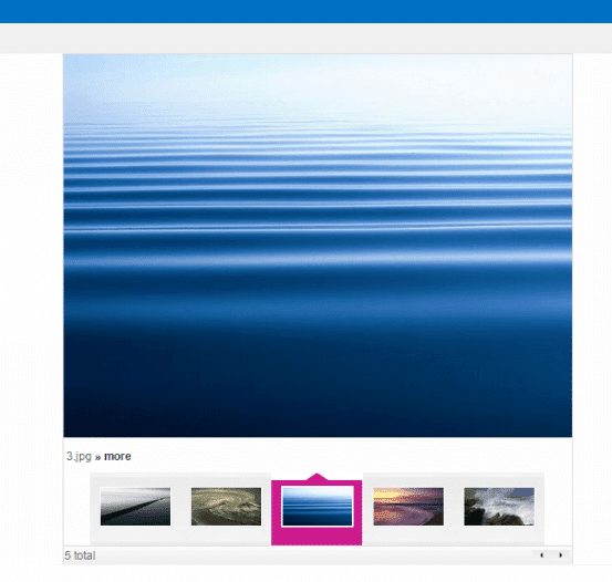 Calm ocean water with gradient from light blue sky to dark blue depths and horizontal ripples
